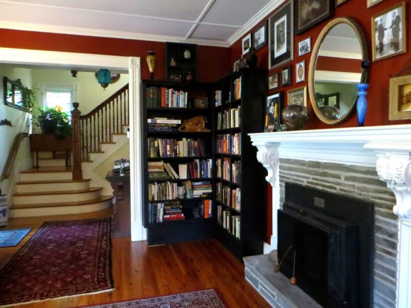 Living Room with books on shelves and fireplace