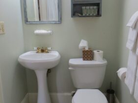Bathroom for Room 2 and 3 featuring pedestal sink